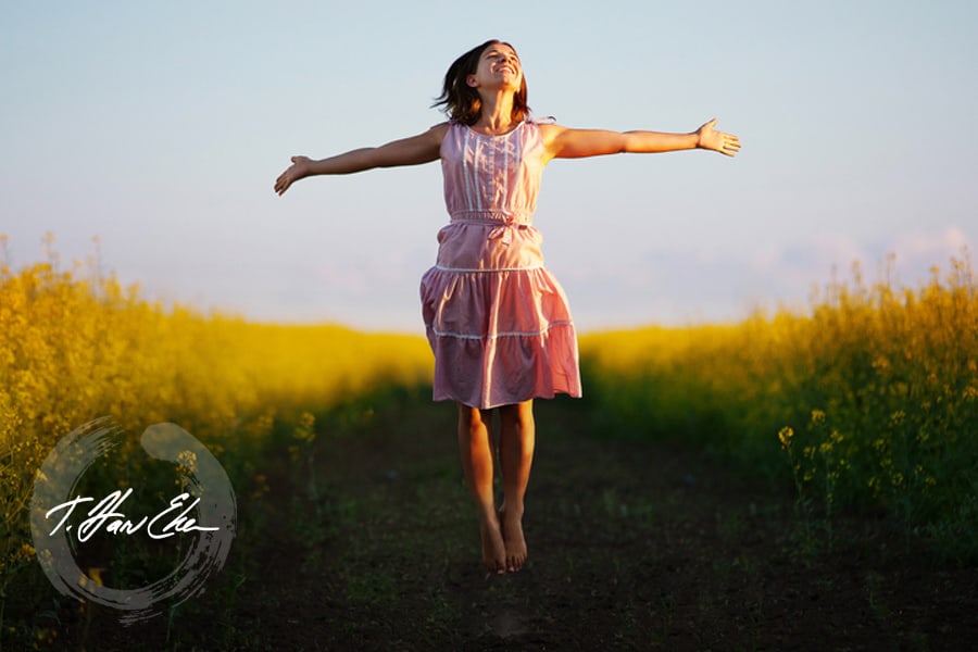 woman arms out field
