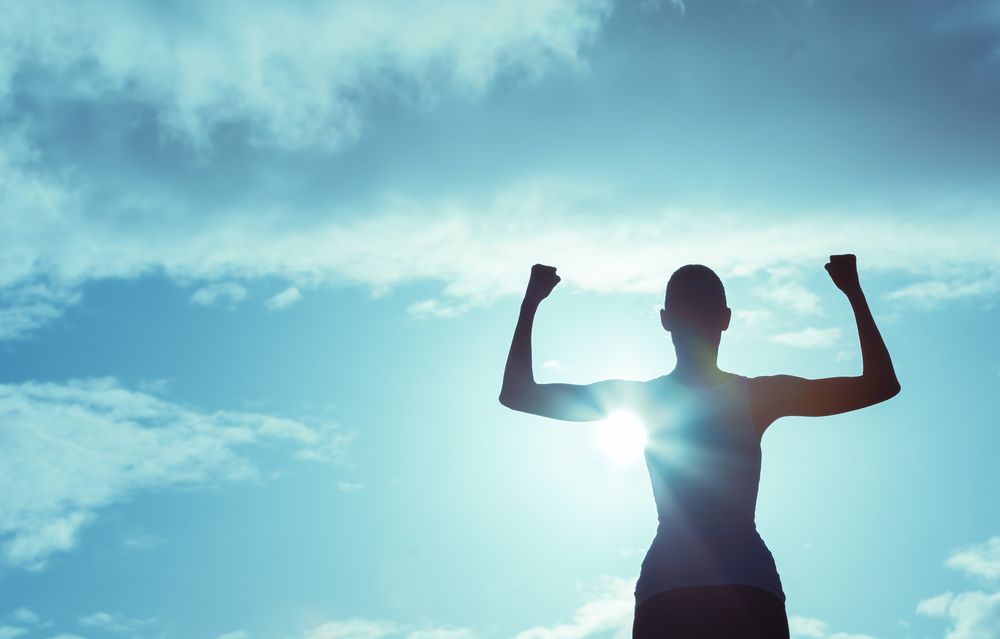 woman with arms up
